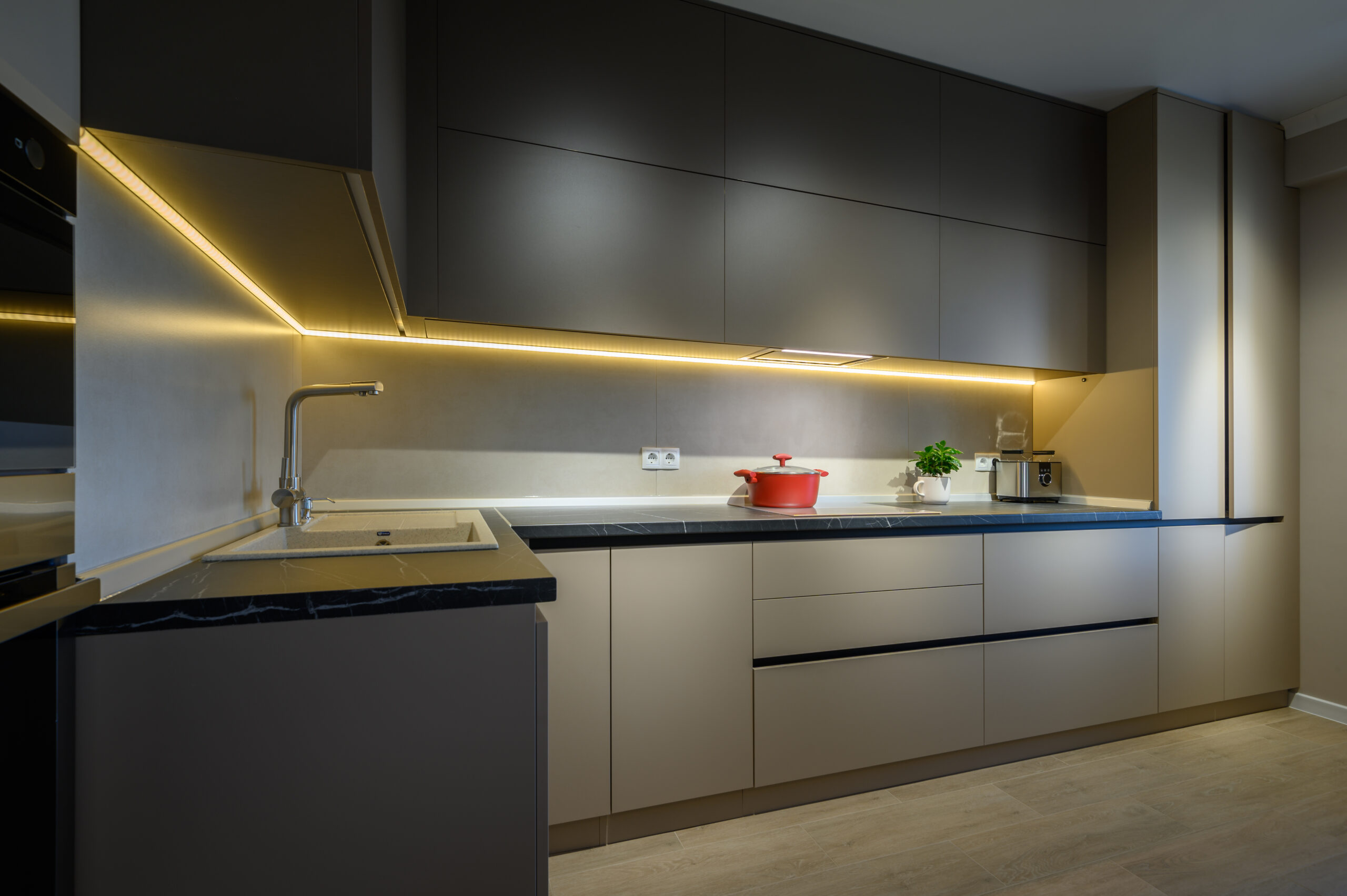 Modern grey luxurious kitchen furniture, closeup to expensive stone worktop