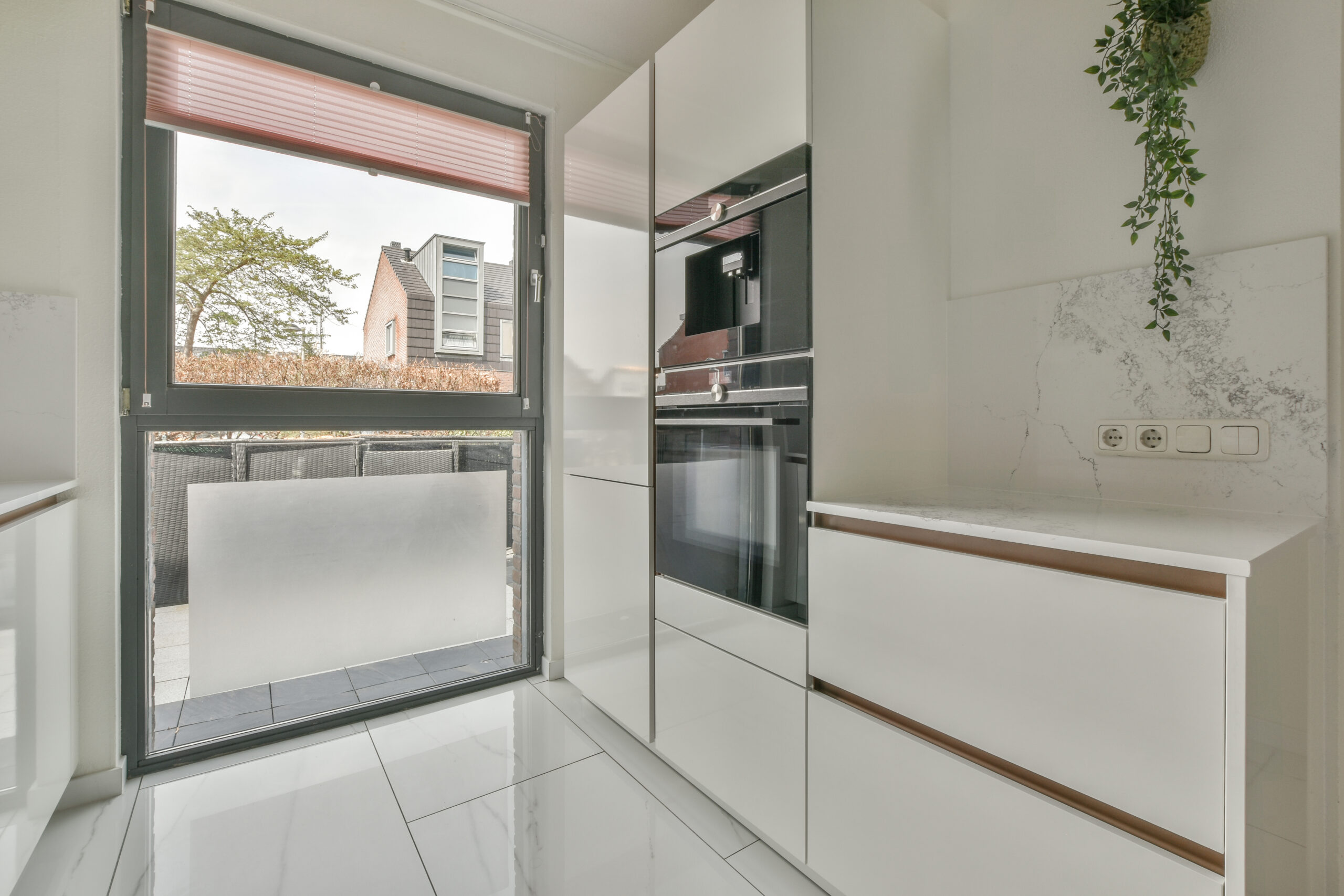 Spacious bright kitchen with dining area, modern design and panoramic windows
