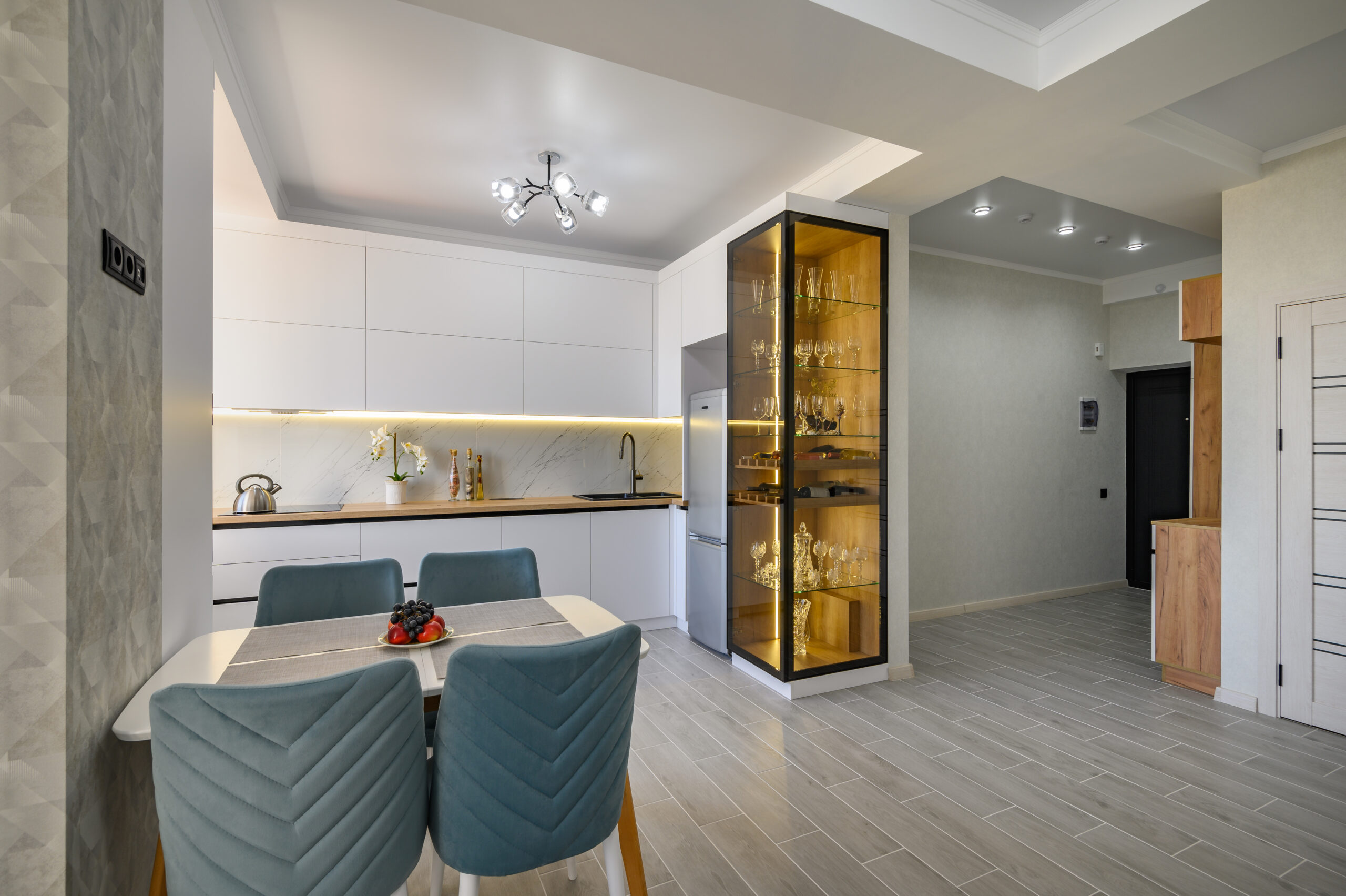 Modern and stylish white studio apartment with fully functional kitchen