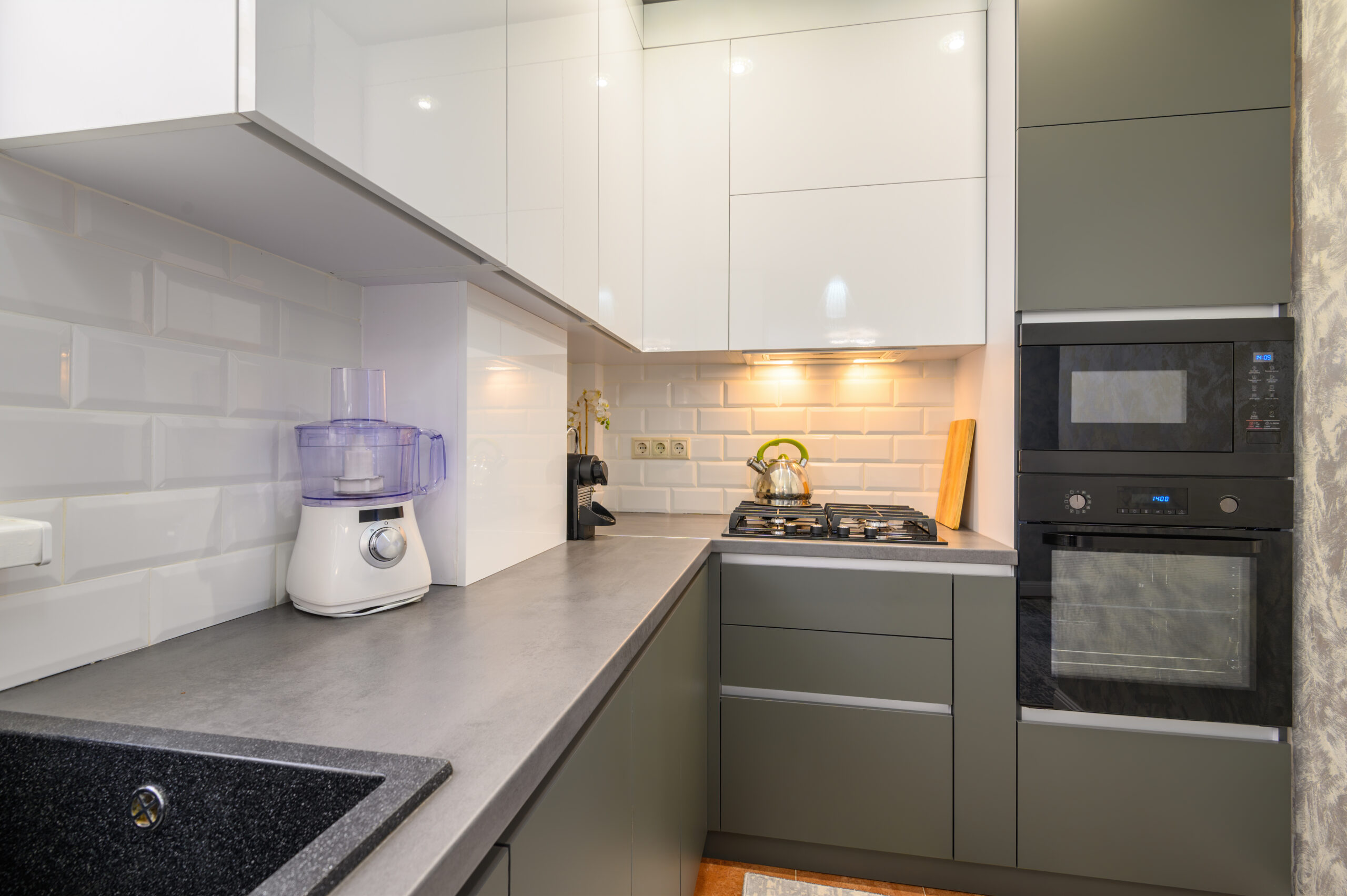 Well designed small dark grey modern kitchen interior