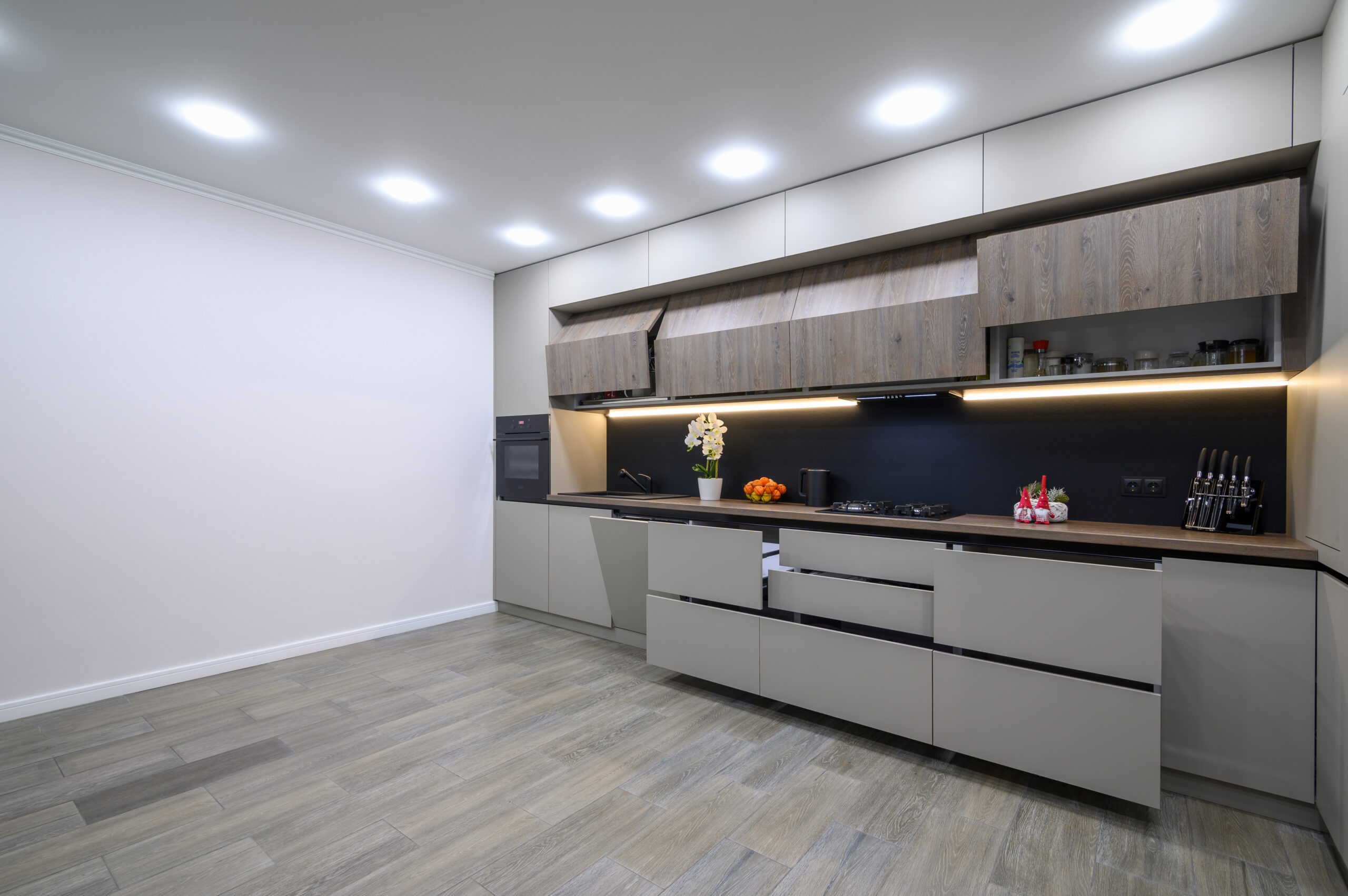 Trendy grey modern kitchen interior showcase with minimalistic furniture
