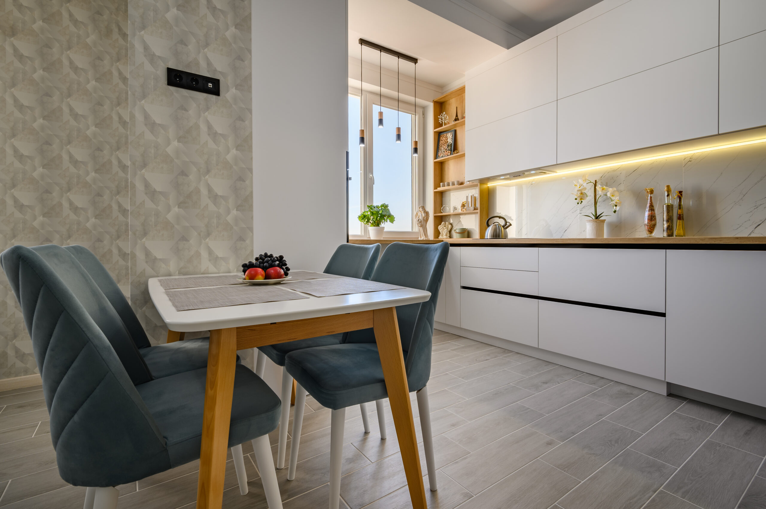 Modern and stylish white studio apartment with fully functional kitchen