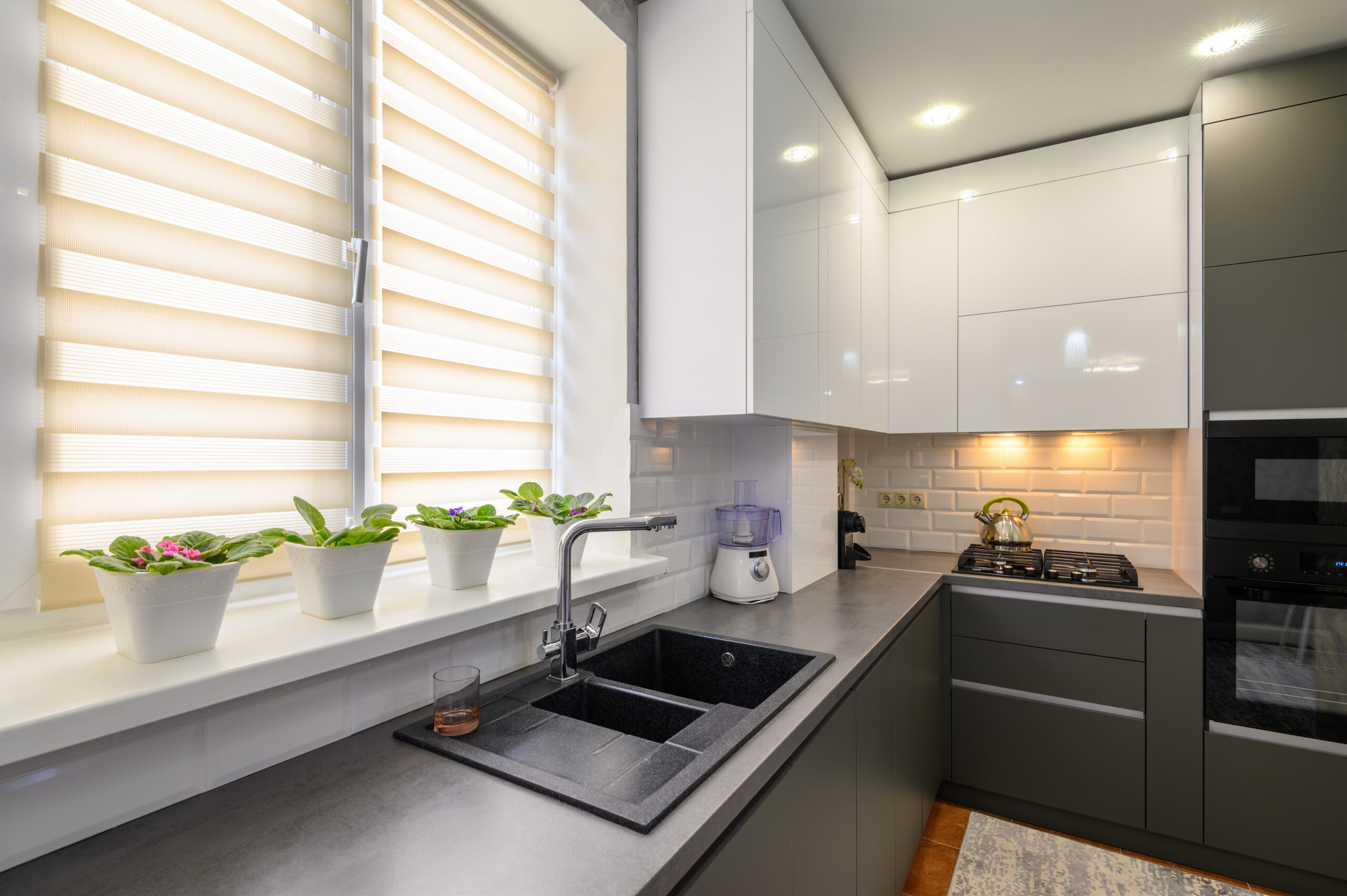 Well designed small dark grey modern kitchen interior