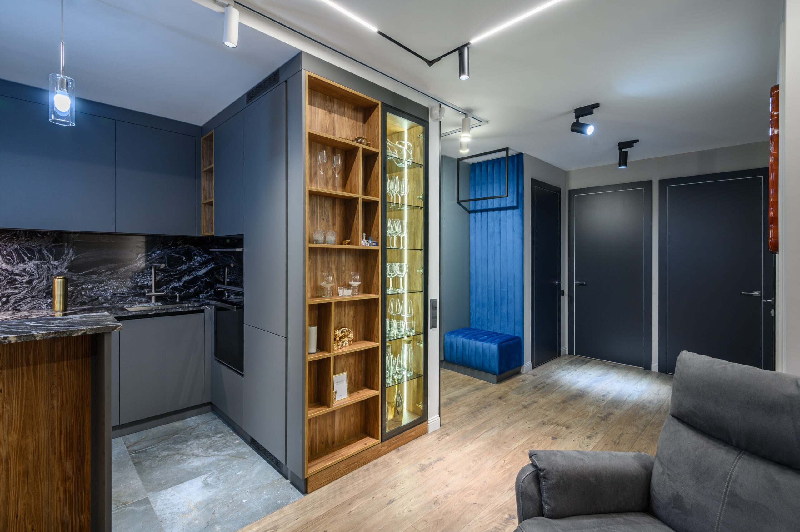 Luxury living room with grey kitchen in studio apartment interior