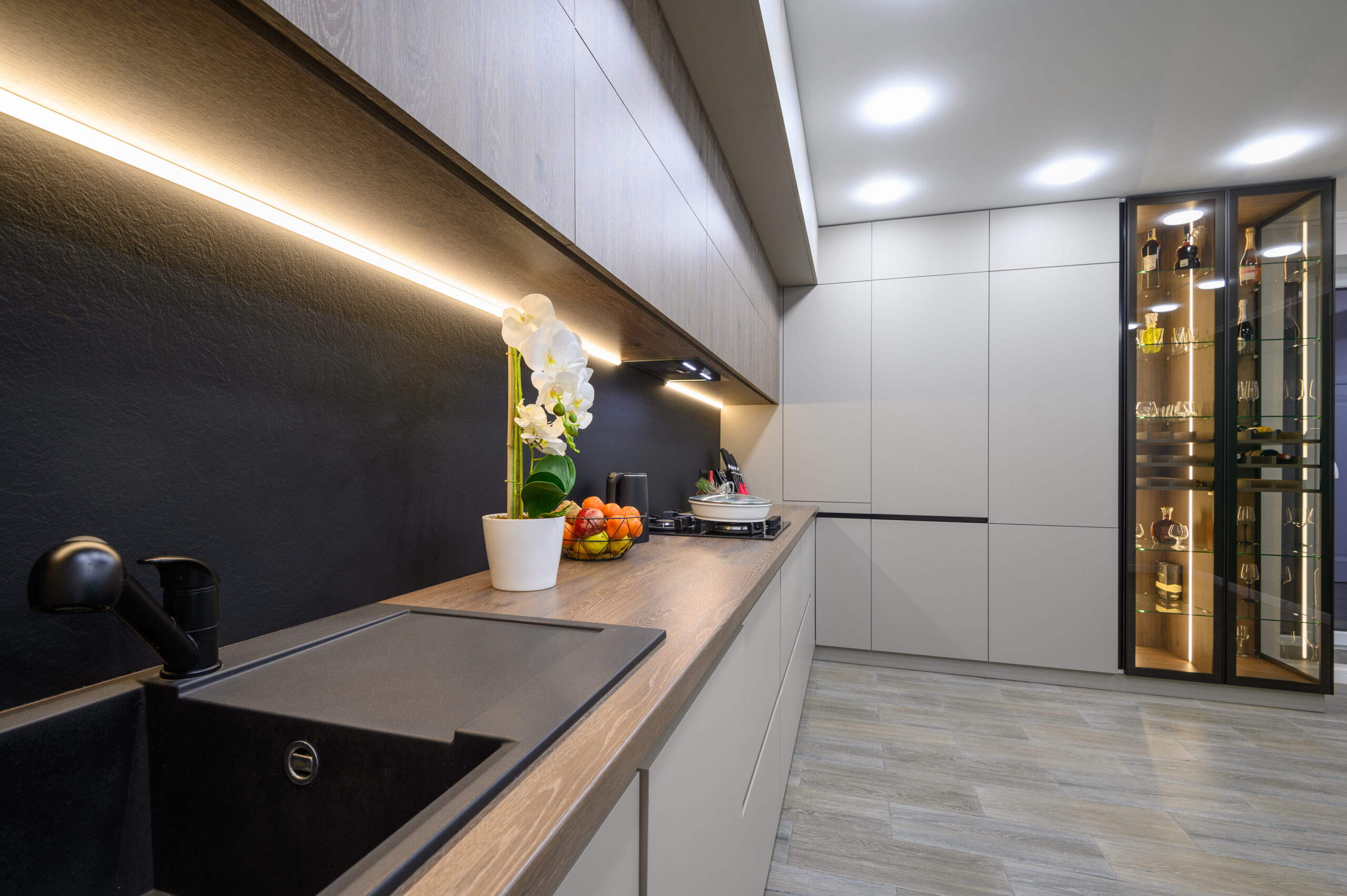 Trendy grey modern kitchen interior showcase with minimalistic furniture and some Christmas decoration at worktop