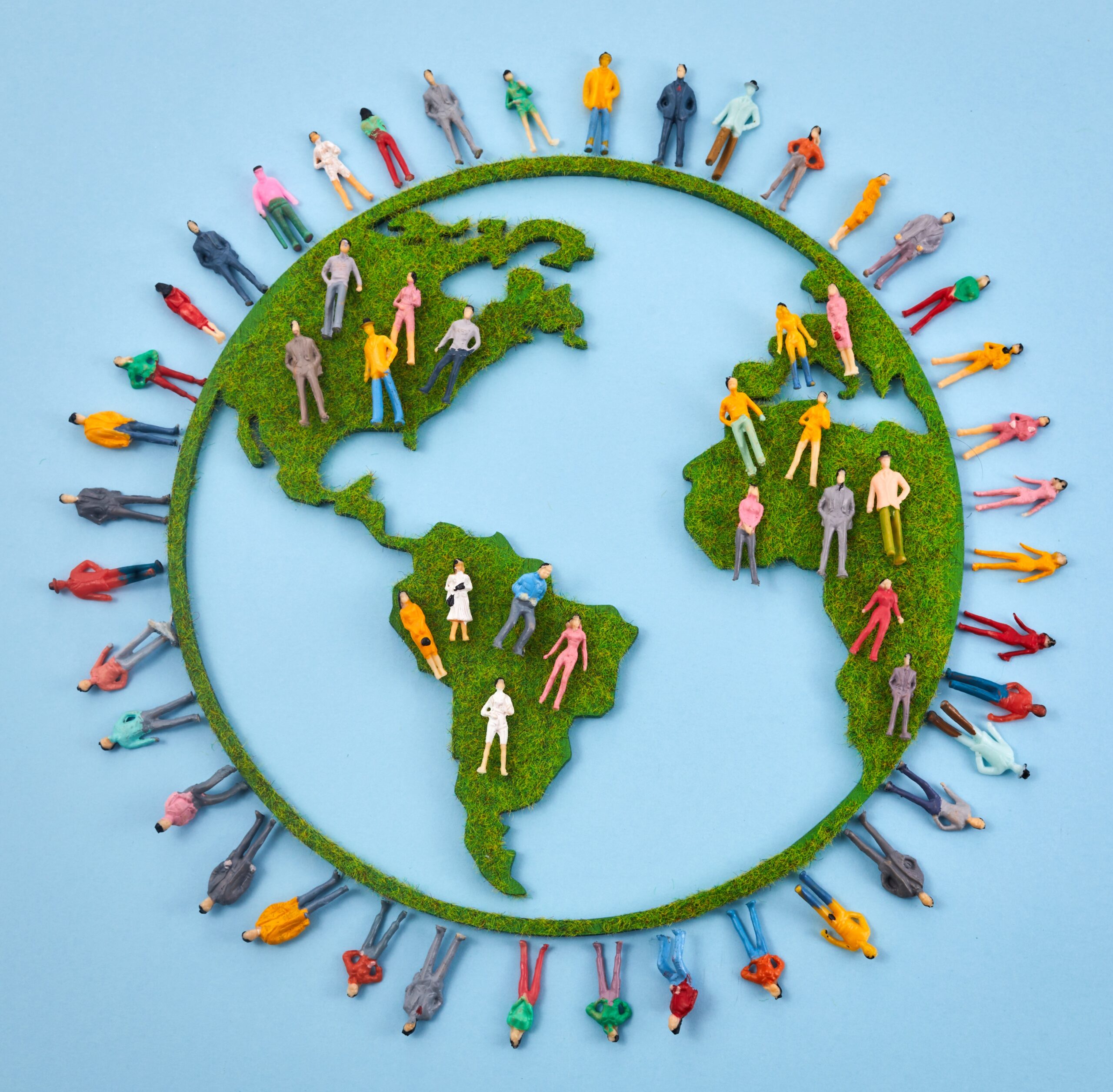 World Population Day, creative concept. Large and diverse group of people in the shape of the world map.